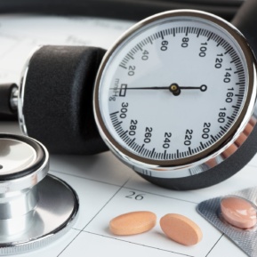 Tablets And Blood Pressure Meter On A Calendar