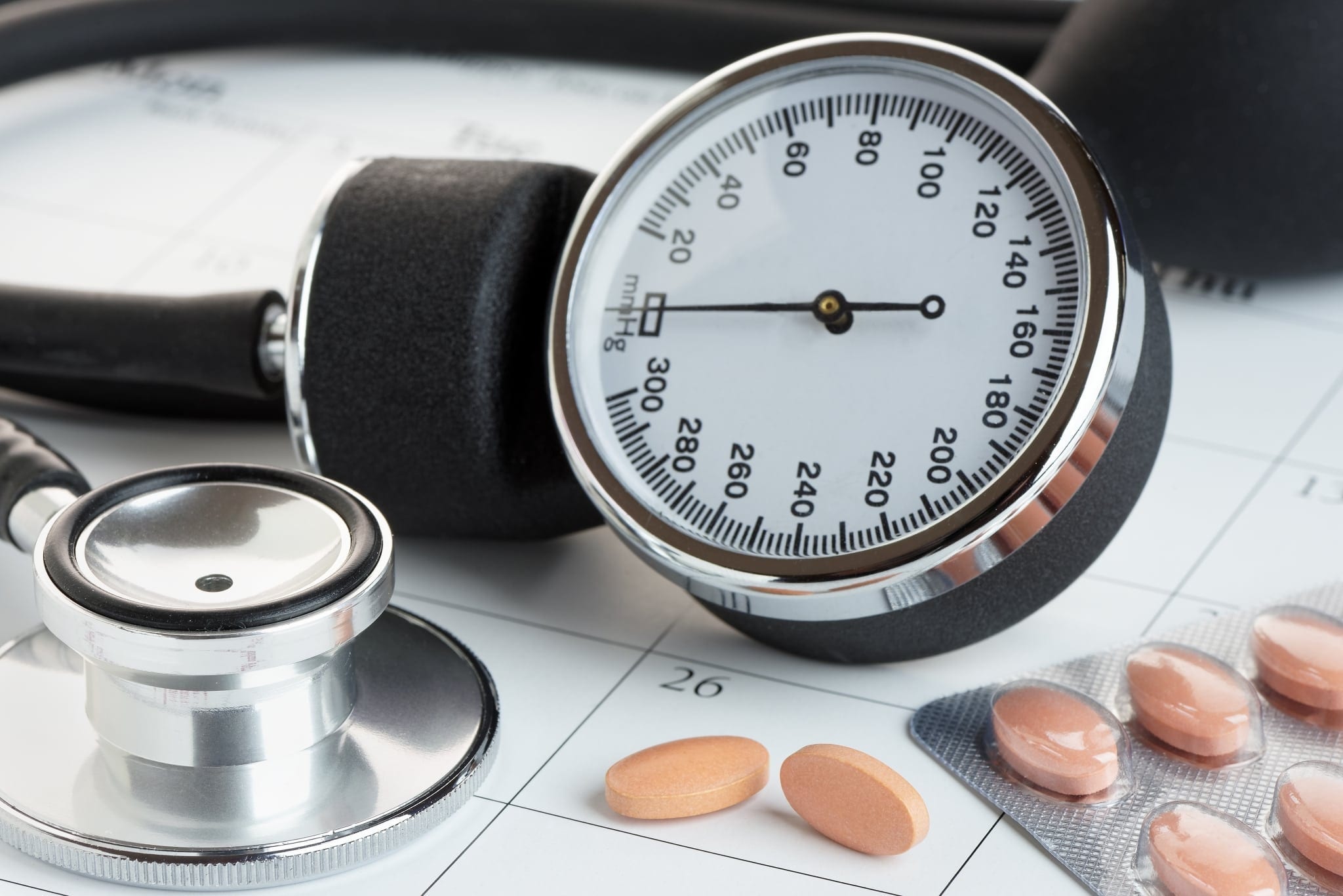 Tablets And Blood Pressure Meter On A Calendar